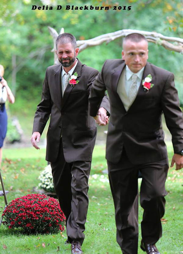 father of bride grabs father in law to walk her down aisle together