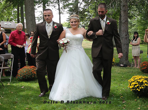 father of bride grabs father in law to walk her down aisle together