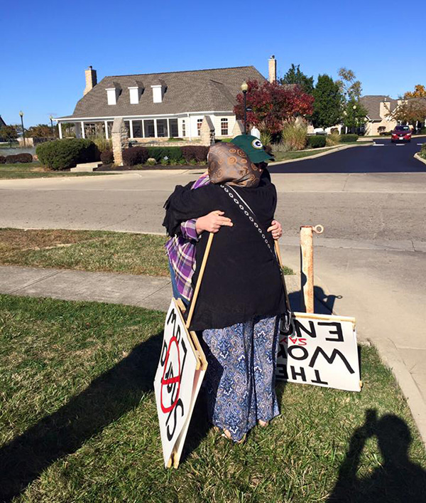 woman protesting islam gets hug