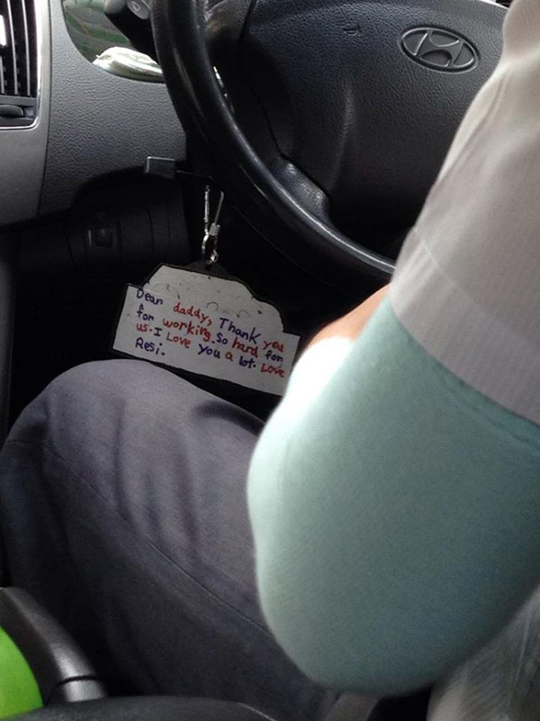cab driver note hanging from steering wheel