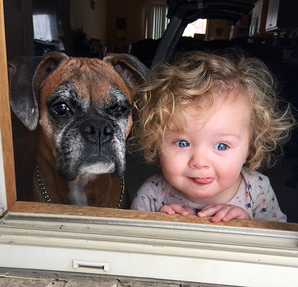 dog and daughter first snow