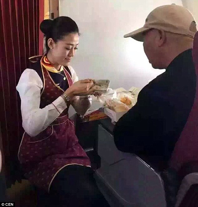 flight attendant feeds disable man