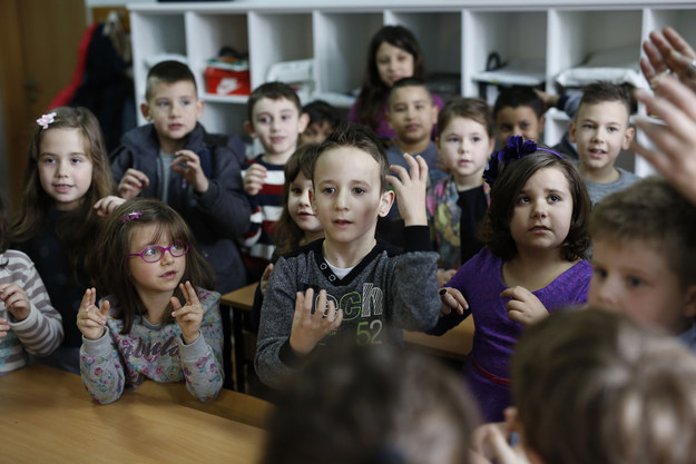 kids learn sign language to communicate with classmate