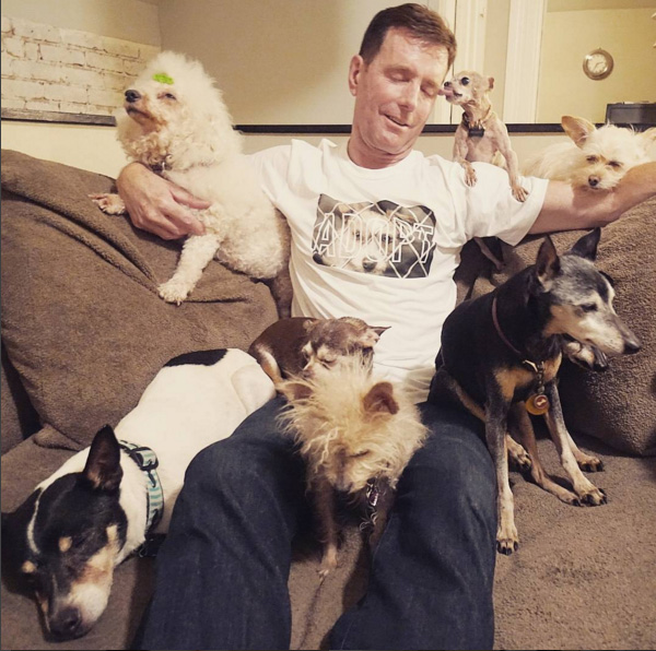 man adopts dogs