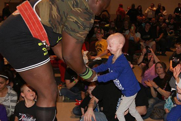 huge bodybuilder bond with girl with cancer