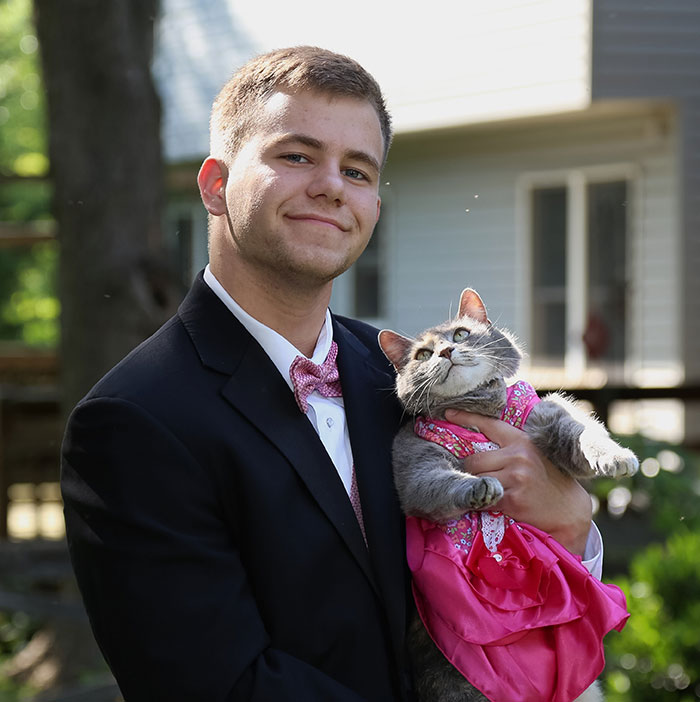 guy takes his cat to prom