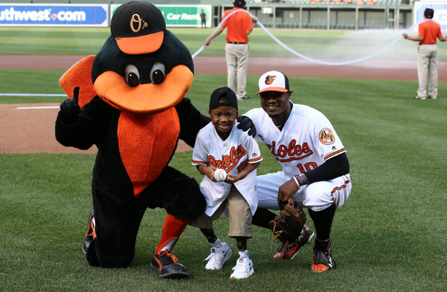 boy double hands transplant throws first pitch Orioles
