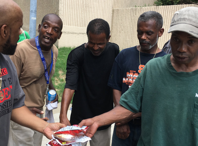 woman uses coupon to feed homeless