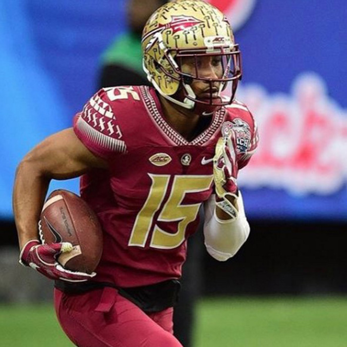 Florida State football player eats lunch with boy autism