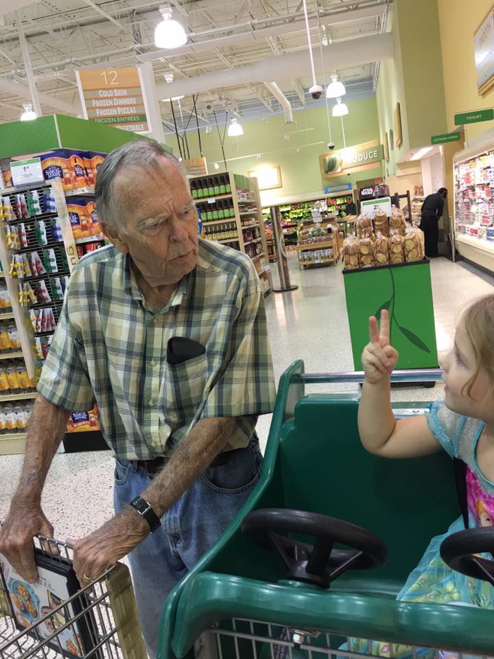 little girl helps old man good news