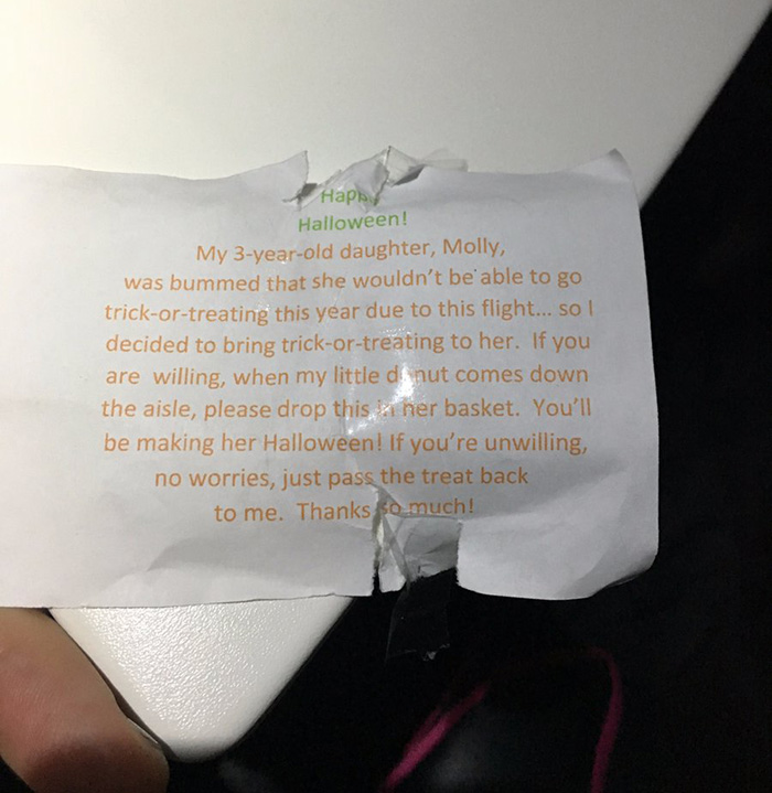 dad trick or treats on plane with daughter