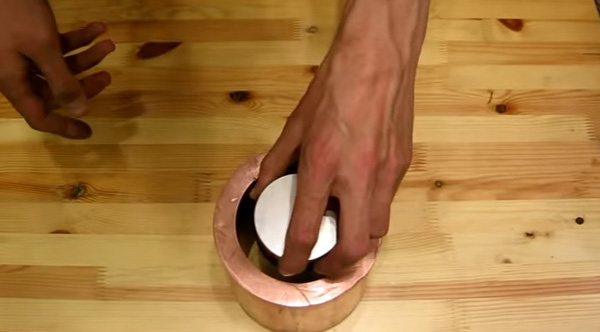 Neodymium magnet going through a copper pipe - GIF on Imgur
