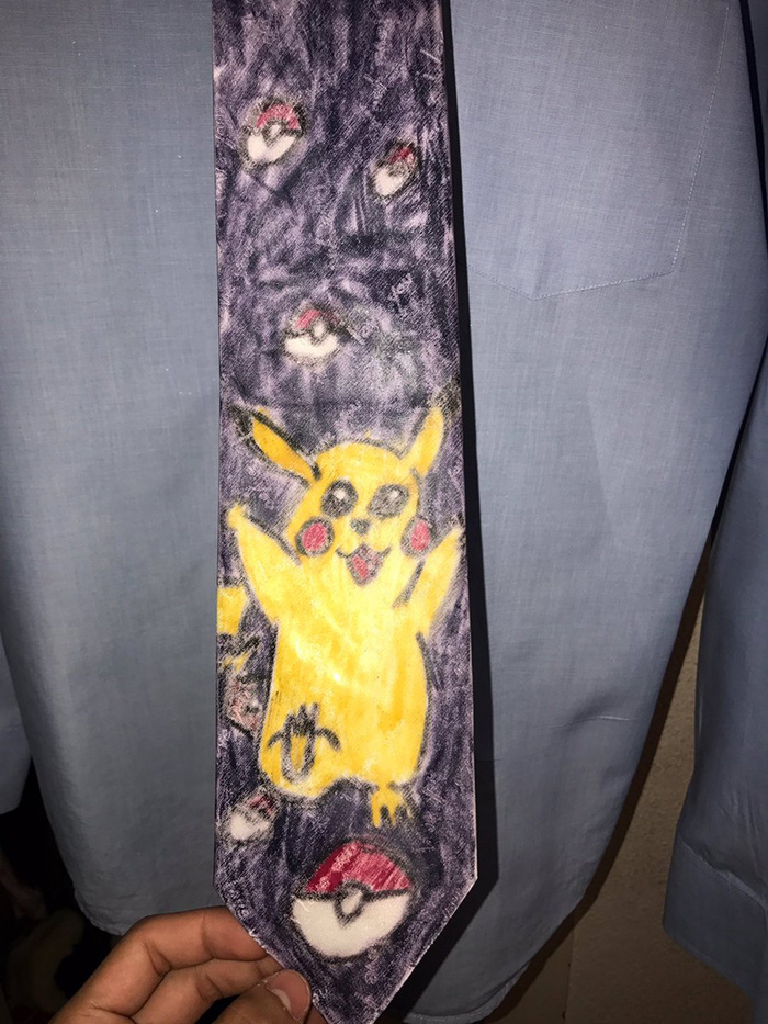 dad wears Pokemon tie graduation son made