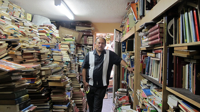 garbage man opens library with books in trash
