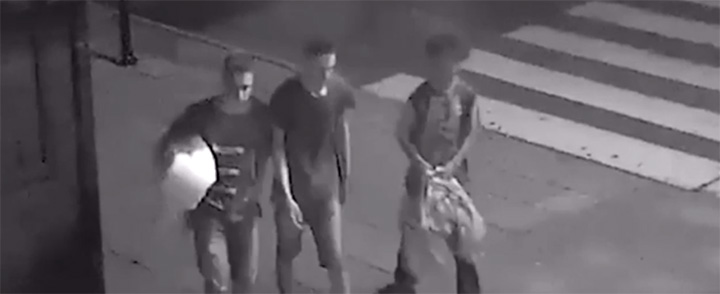 three boys help homeless man in Poland