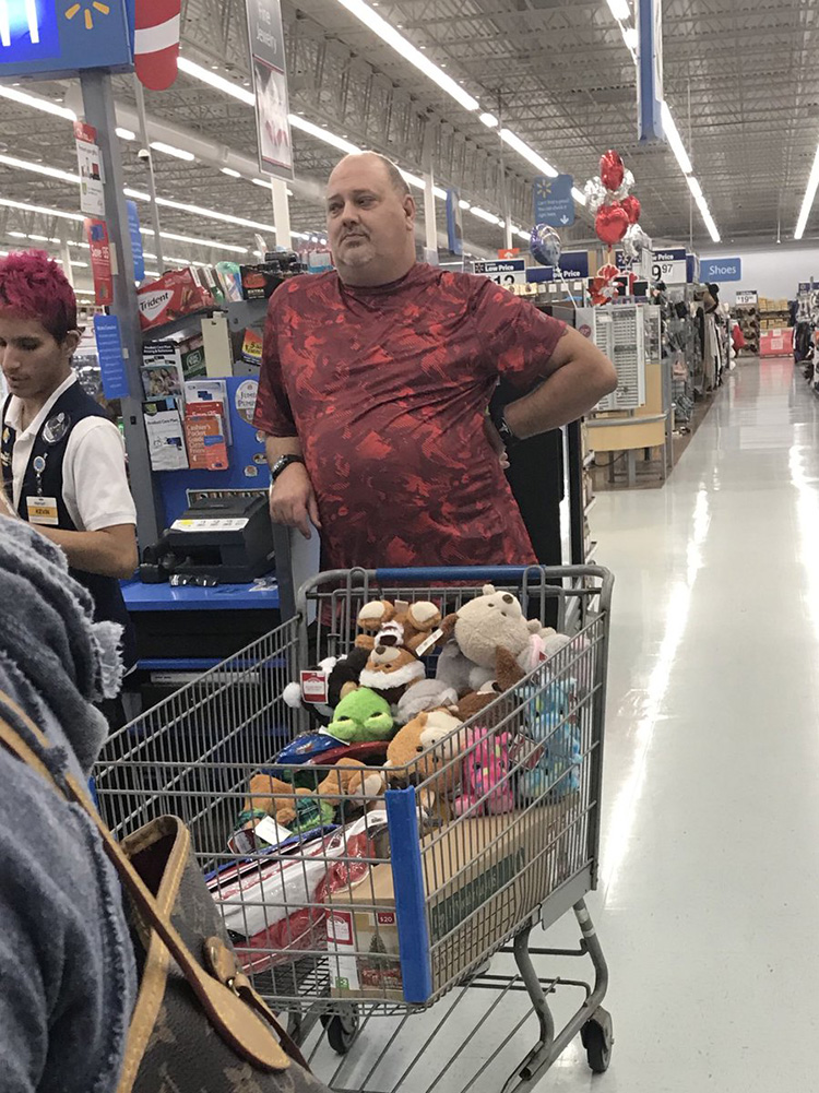 man buying stuffed animals in walmart for kids in ER