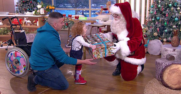 Esme Hodge walks first time to meet Santa