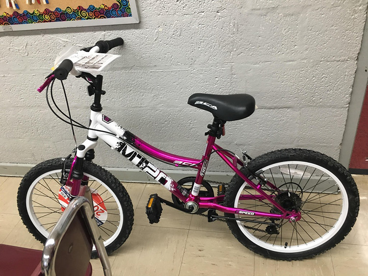 student brings in bike for giving tree