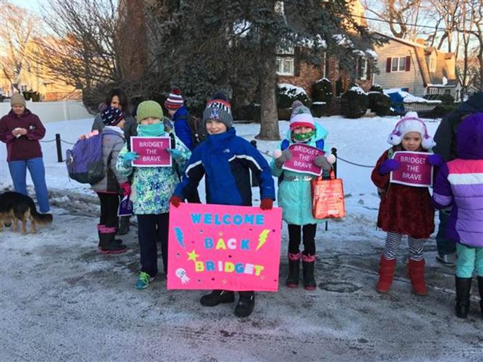 students staff welcome back kid cancer