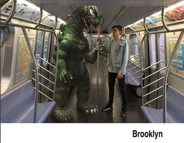 man travels with godzilla toy photoshop