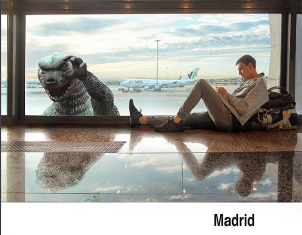 man travels with godzilla toy photoshop