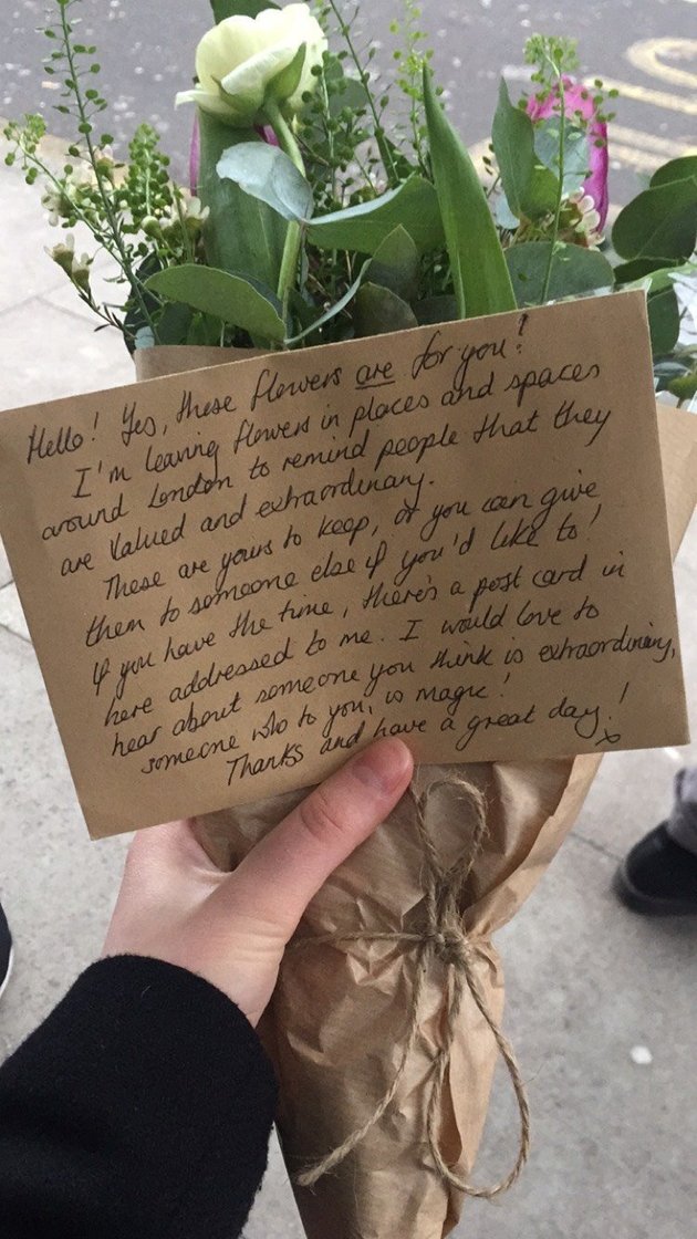 woman finds flowers on bus act of kindness