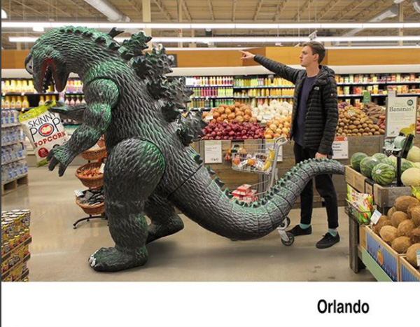 man travels with godzilla toy photoshop