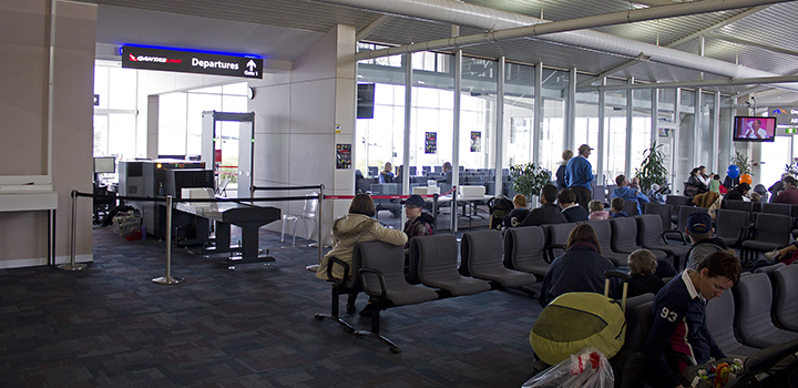 women surround cryng mom at airport