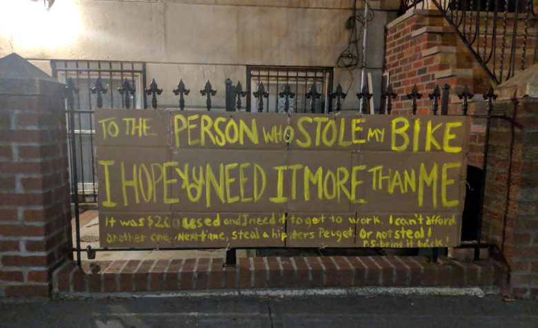 woman makes sign after someone stole her bike and kindness followed