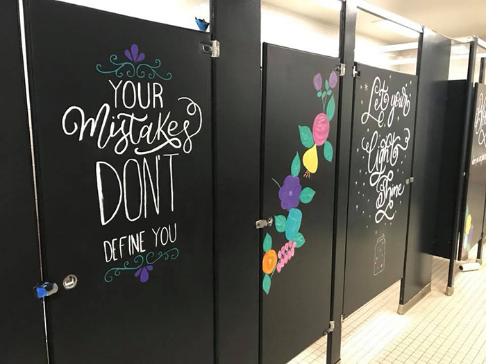 parents paint bathroom stalls inspirational messages