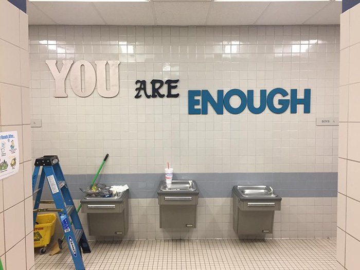 parents paint bathroom stalls inspirational messages