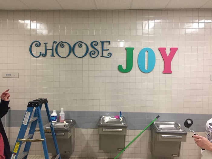 parents paint bathroom stalls inspirational messages