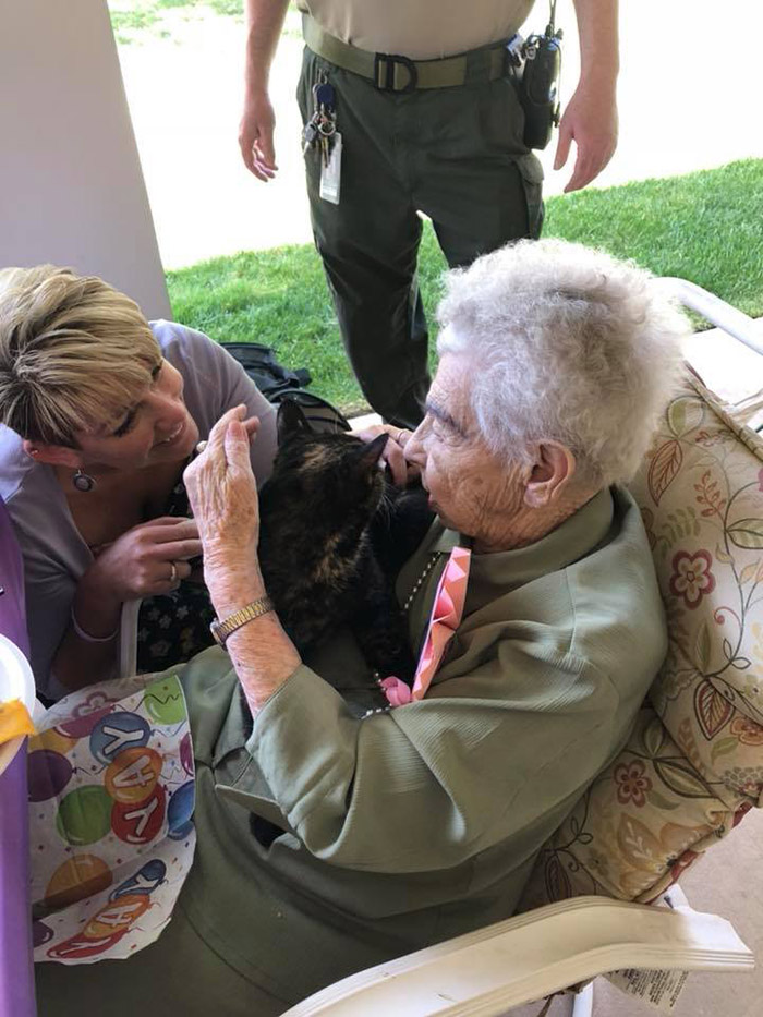 woman surprised with cat 103 birthday