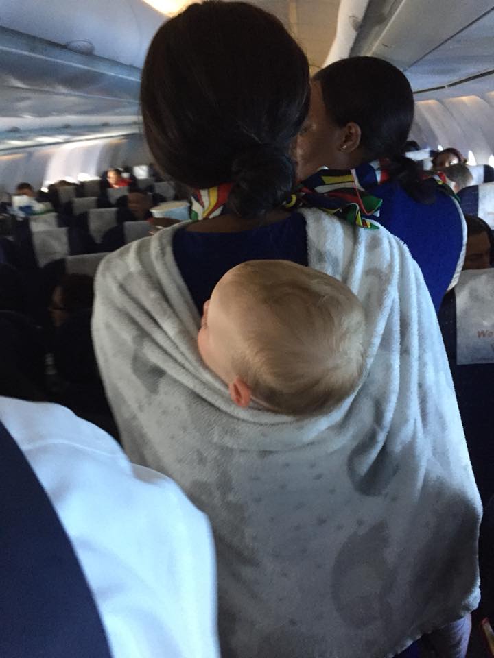 flight attendant takes baby on long flight
