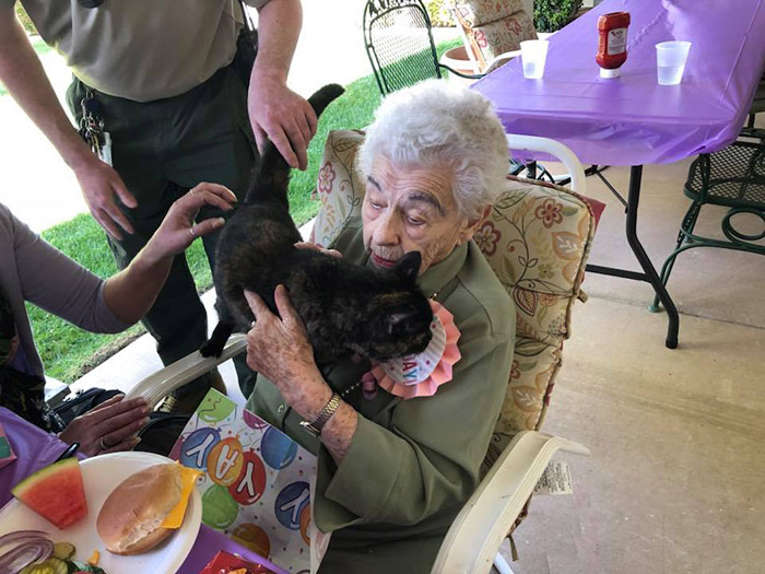 woman surprised with cat 103 birthday