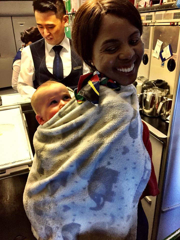 flight attendant takes baby on long flight