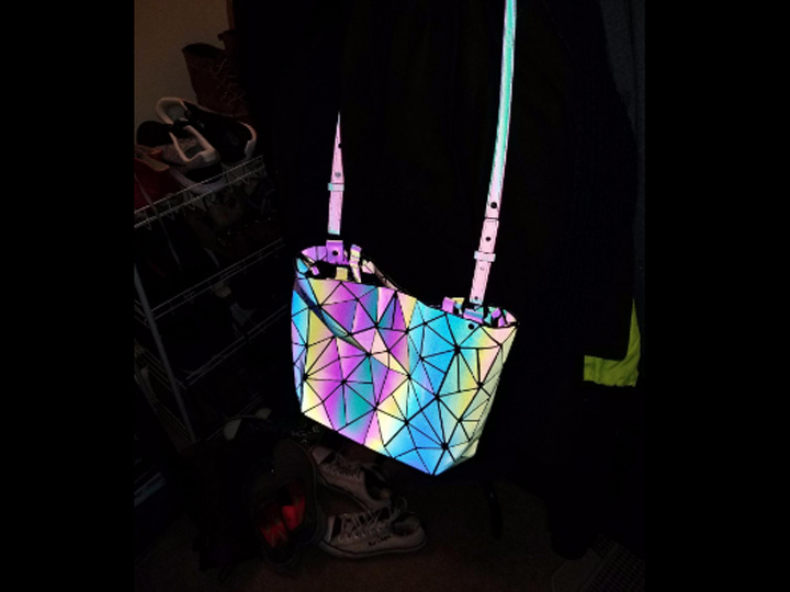 black purse that shines glows with flash