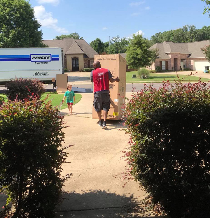 delivery man makes little boys day box