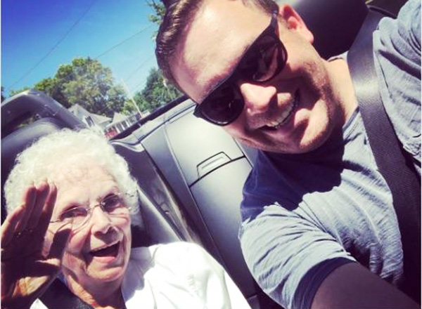 man takes elderly woman for spin while waiting for post office to open