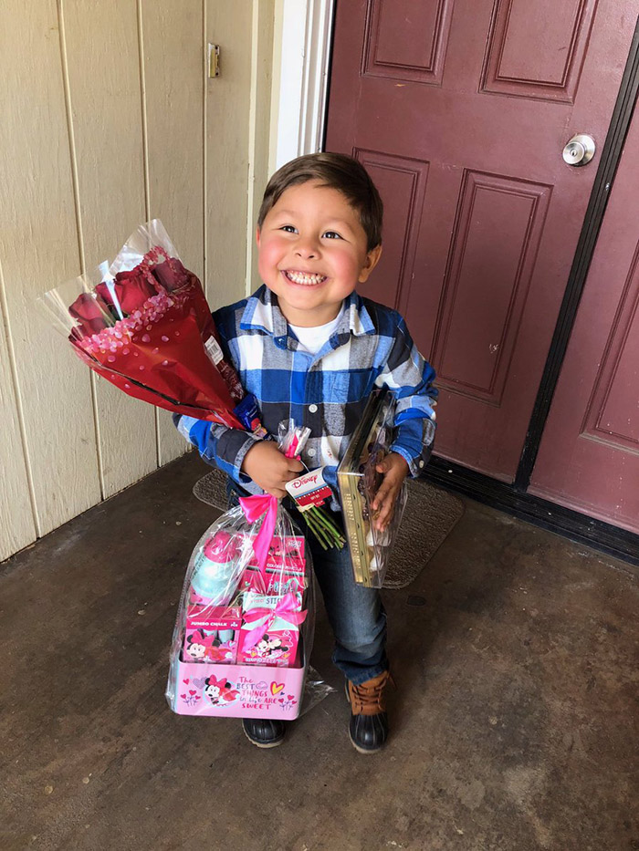 little boy so happy to give girlfriend gift on valentines day