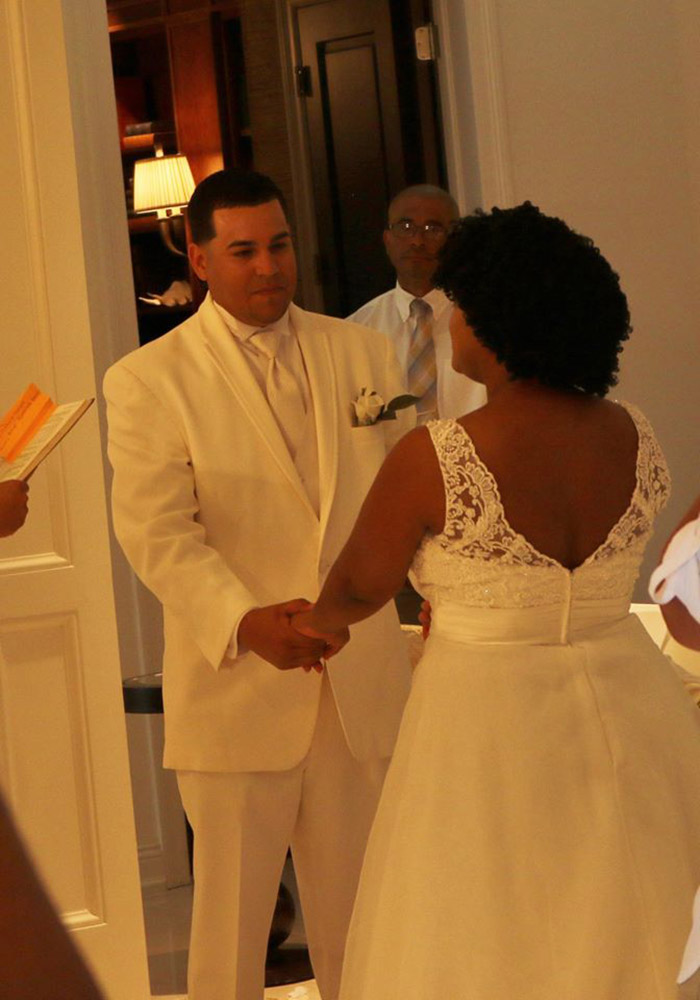 couple invites wedding guests into home when it rains on beach