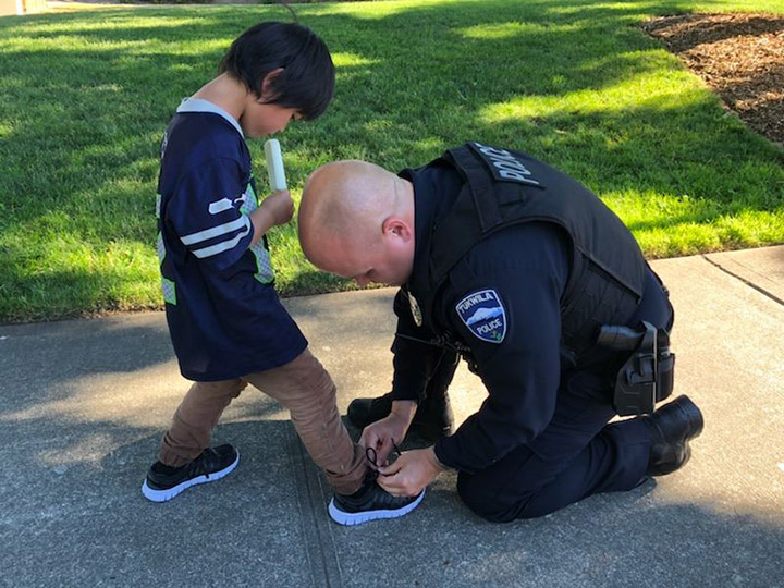 cop buys kid shoes