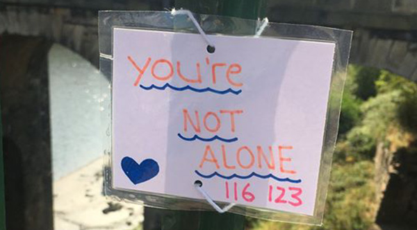 Teen Attaches Uplifting Notes To A Bridge And It's Saving 