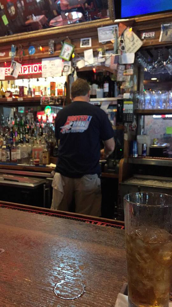 bartender serves homeless man