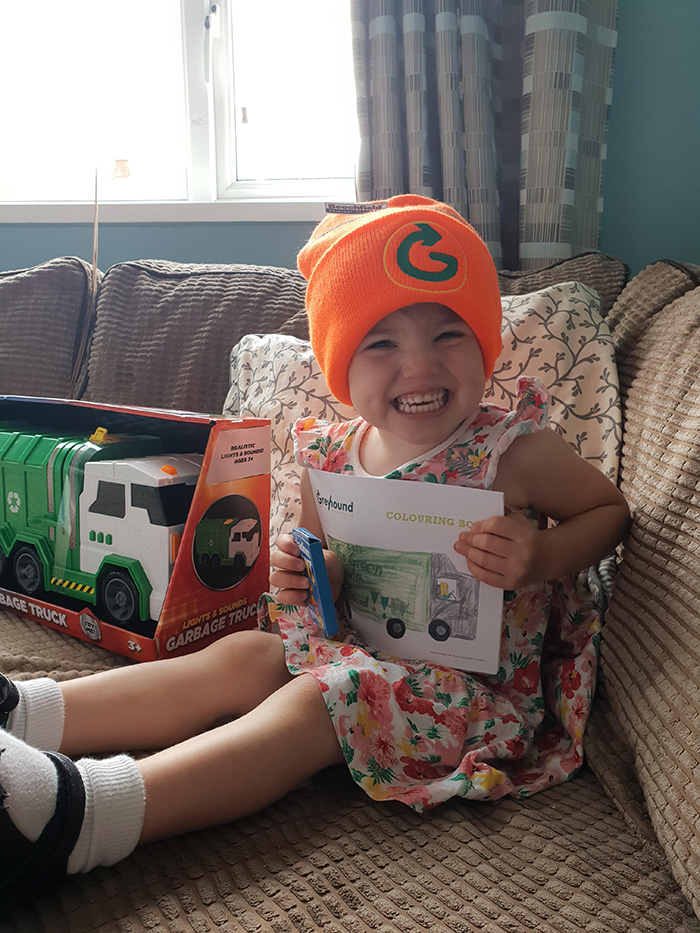 garbage men surprise little girl with present