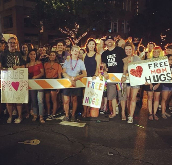 free mom and dad hugs church at pride