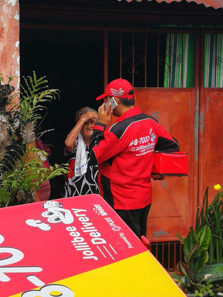 delivery man orders food for elderly woman