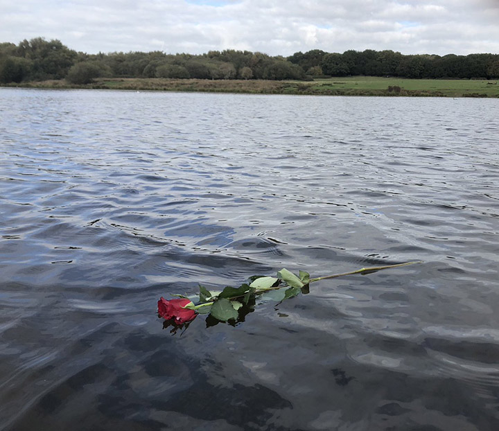 rowing coach rose in lake for grieving woman