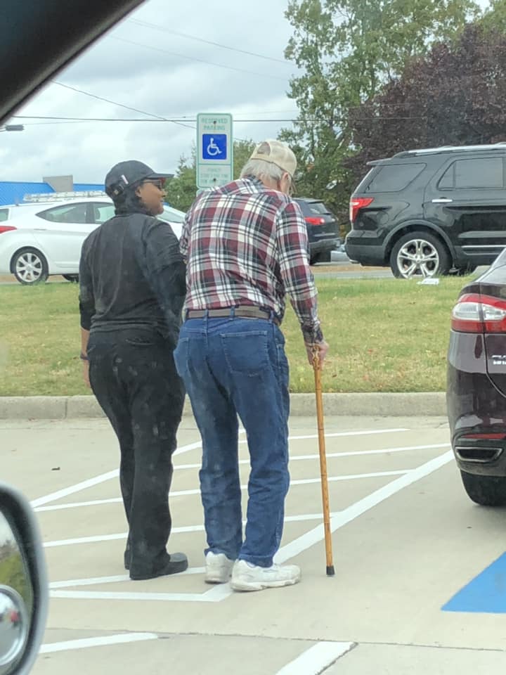 burger king employee walks old man to his car