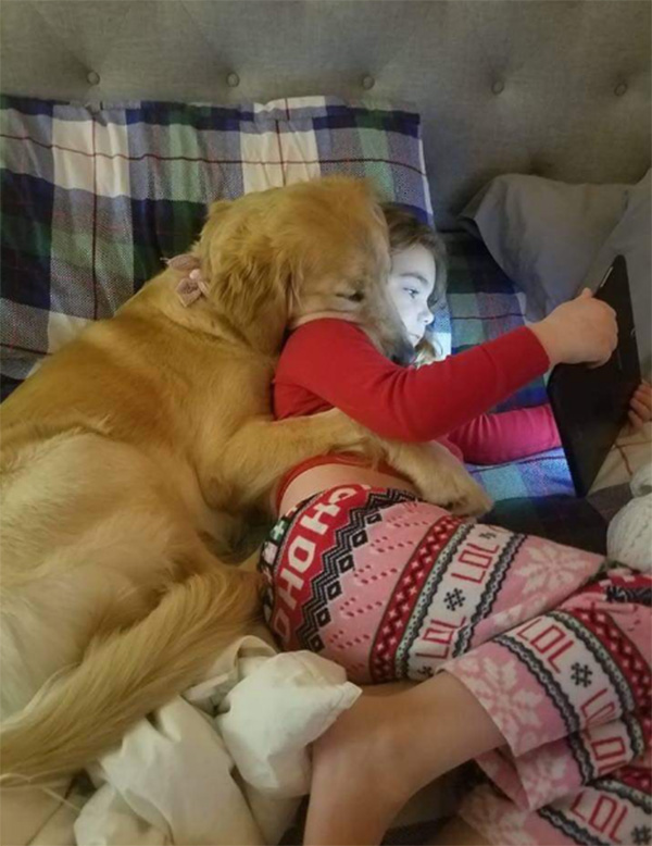 dog and girl spooning